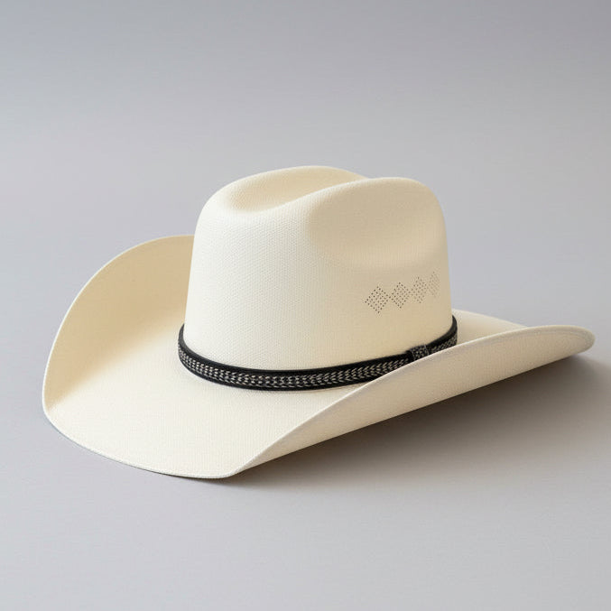 White cowboy hat with a black band on a gray background